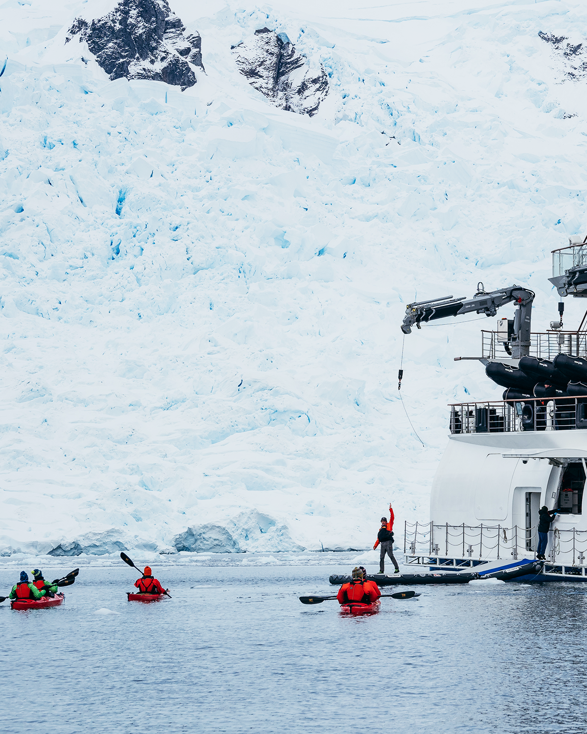 Kayaks leaving the Greg Mortimer activity platform