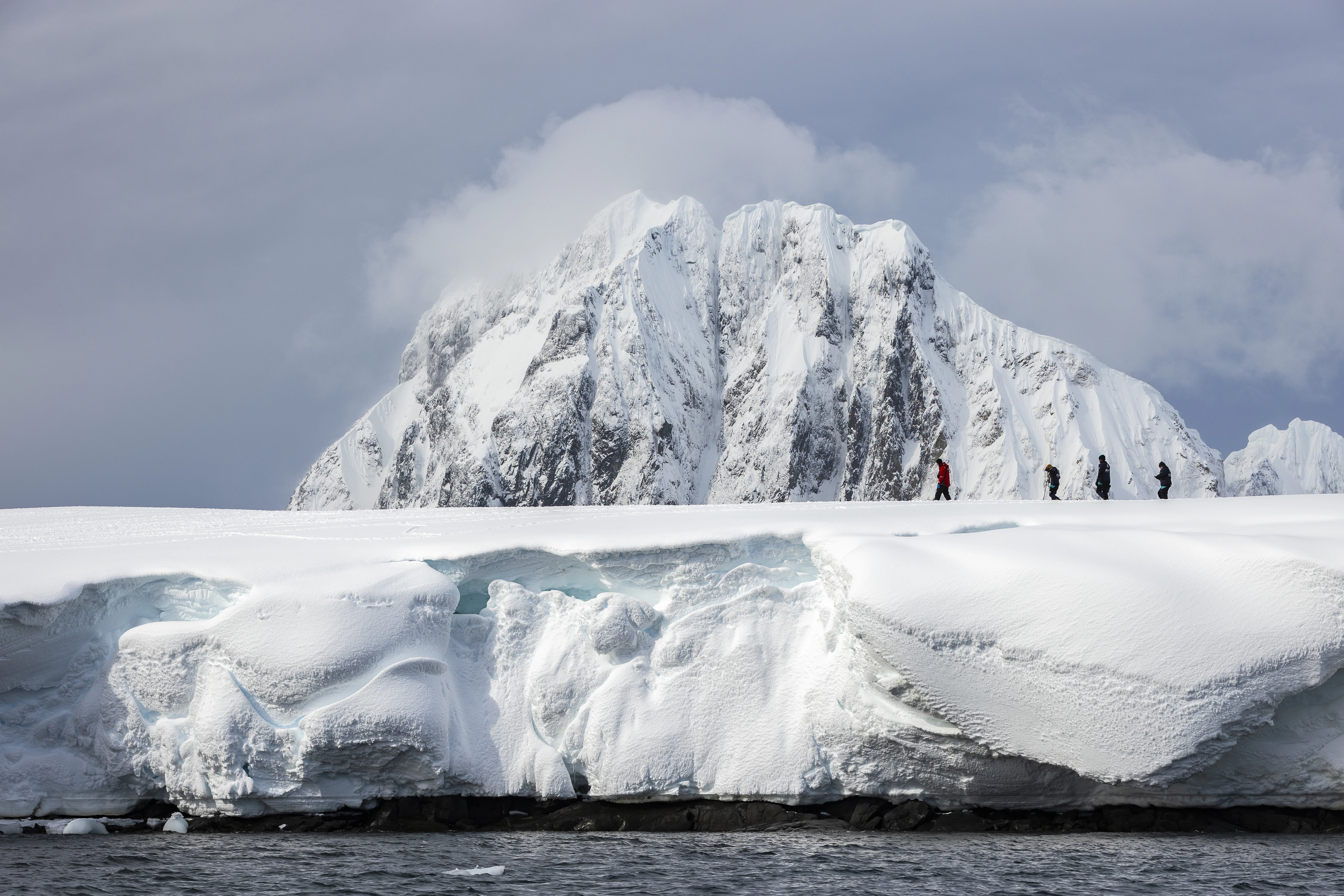 Expedition-team-and-passengers-on-Booth-Island-Antarctic-Peninsula-Richard-IAnson.jpg