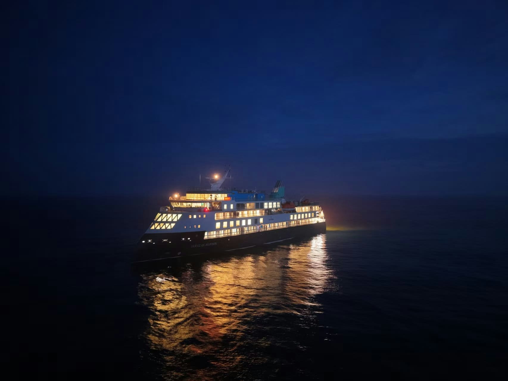 Douglas Mawson illuminated during night sea trials