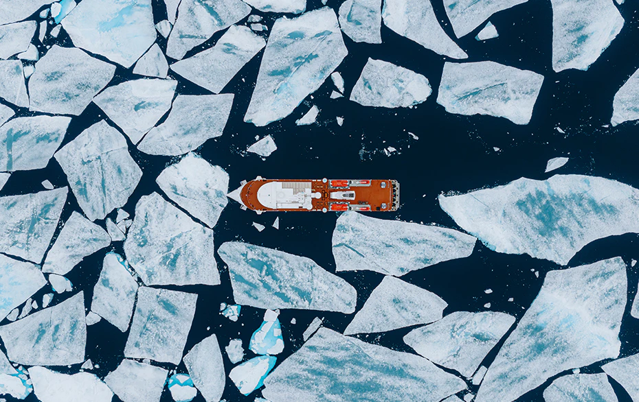 Blog Aerial view of the Greg Mortimer in pack ice, Svalbard