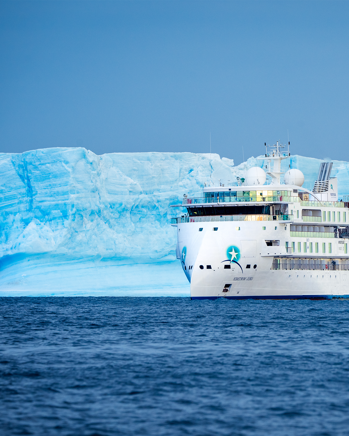 the Greg Mortimer surrounded by ice in antarctica